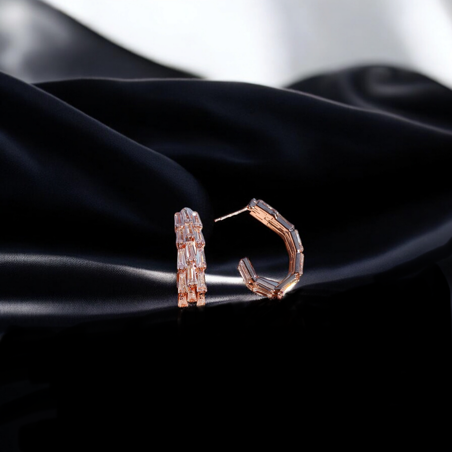 Dazzling hoops adorned with vibrant gemstone.