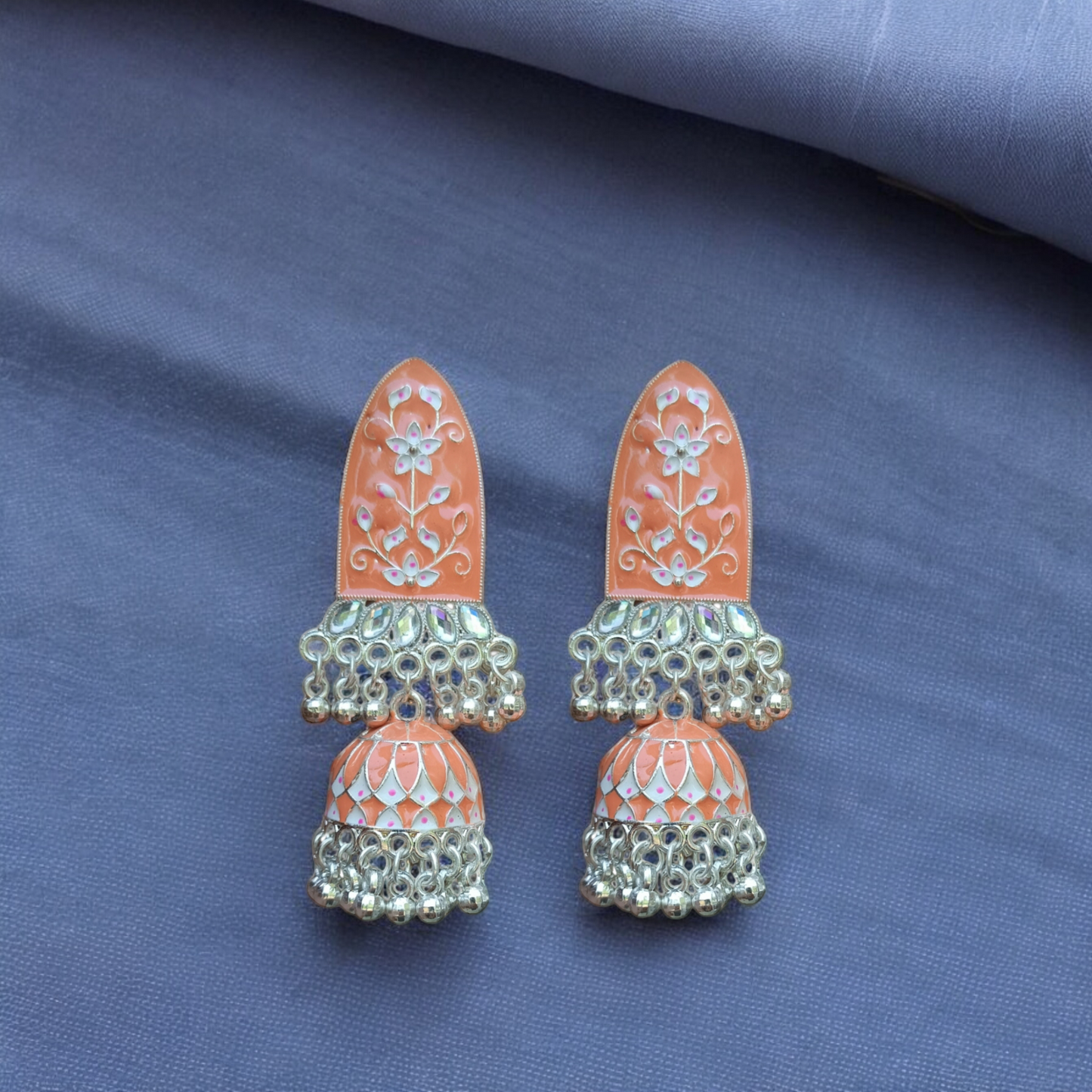 Traditional jhumkas with a blend of silver elegance."Earrings