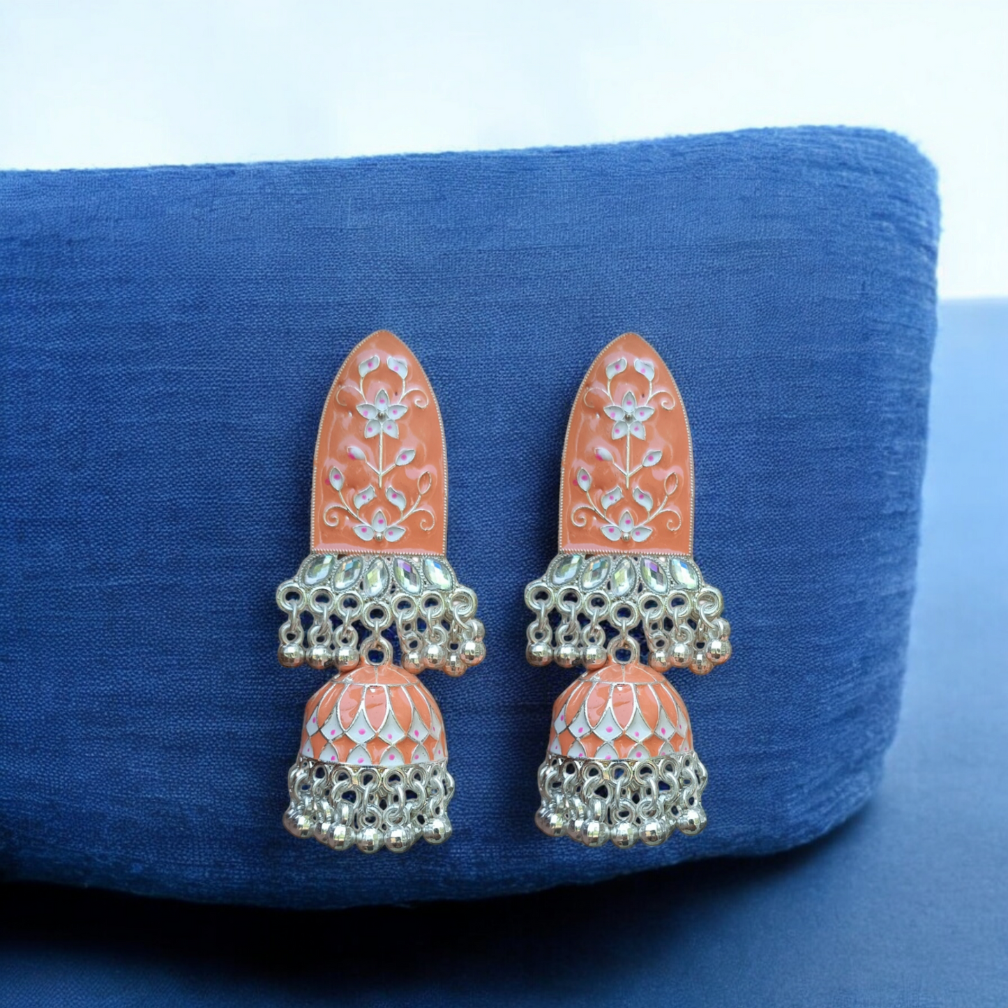 Traditional jhumkas with a blend of silver elegance."Earrings