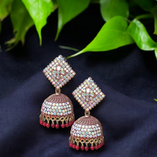 Traditional jhumkas with a blend of red and silver stone elegance.