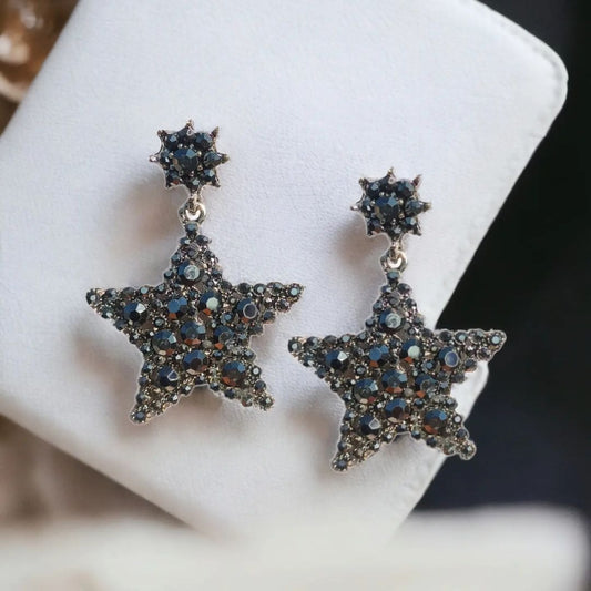 Gleaming star-shaped earrings with dark crystal embellishments