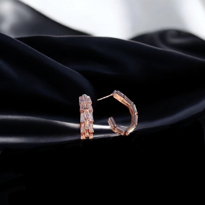 Dazzling hoops adorned with vibrant gemstone.