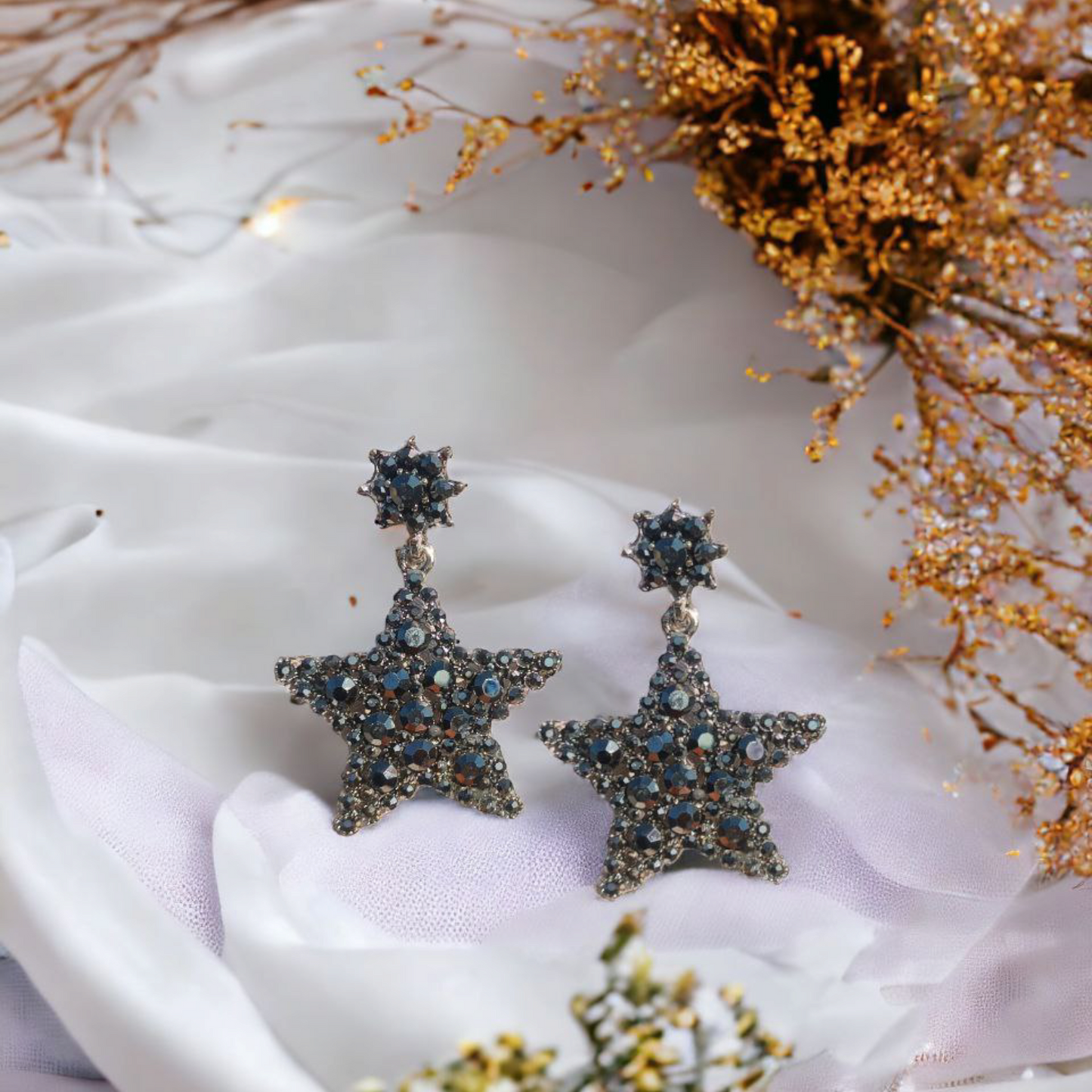 Gleaming star-shaped earrings with dark crystal embellishments