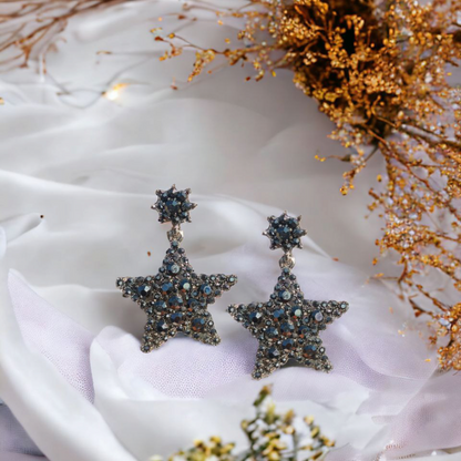 Gleaming star-shaped earrings with dark crystal embellishments