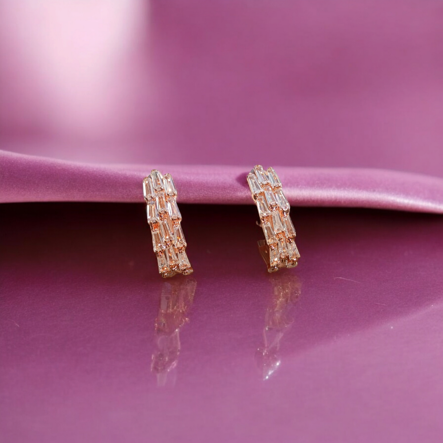 Dazzling hoops adorned with vibrant gemstone.