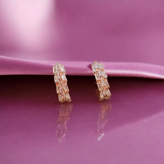 Dazzling hoops adorned with vibrant gemstone.