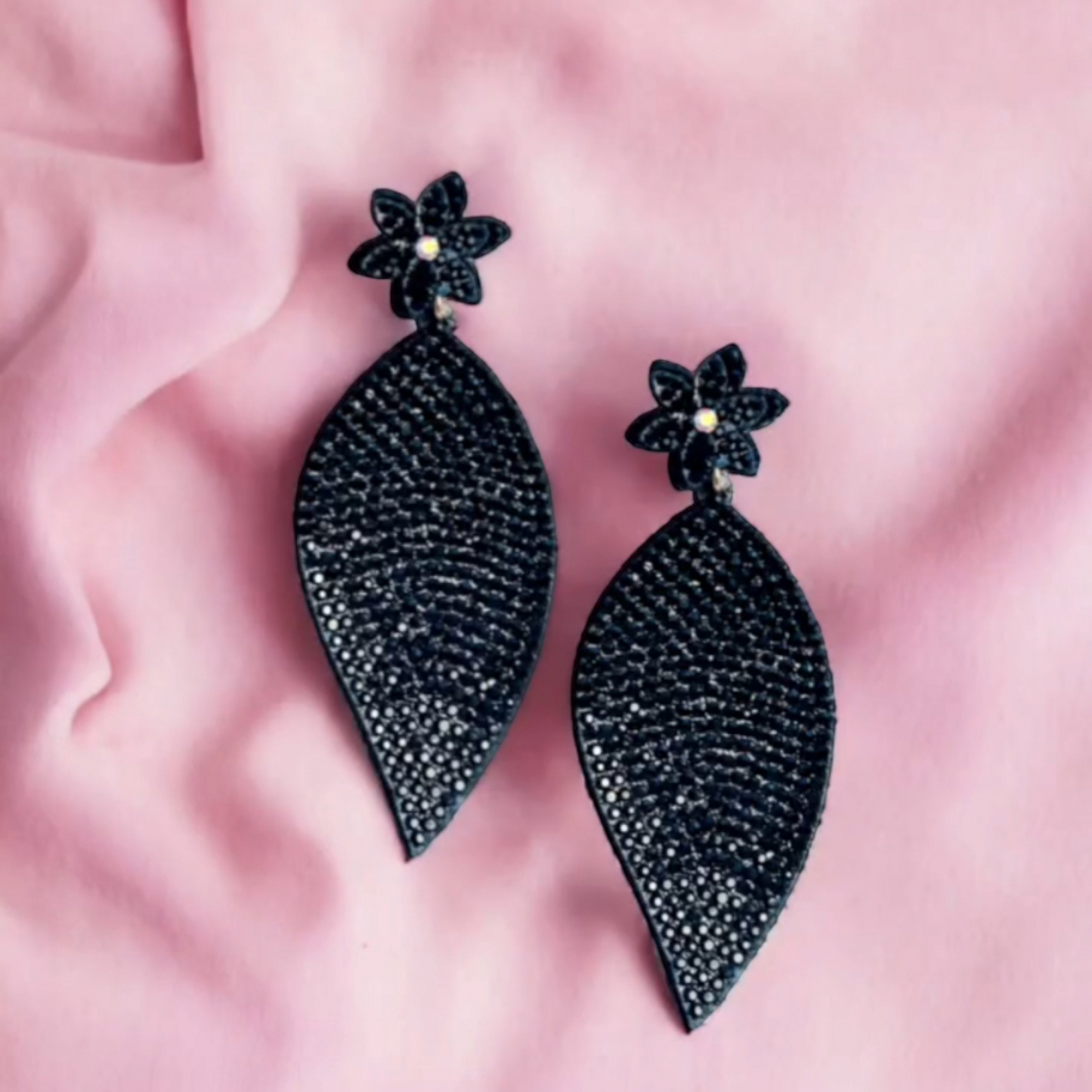 Striking large petal earrings crafted from vibrant beads.